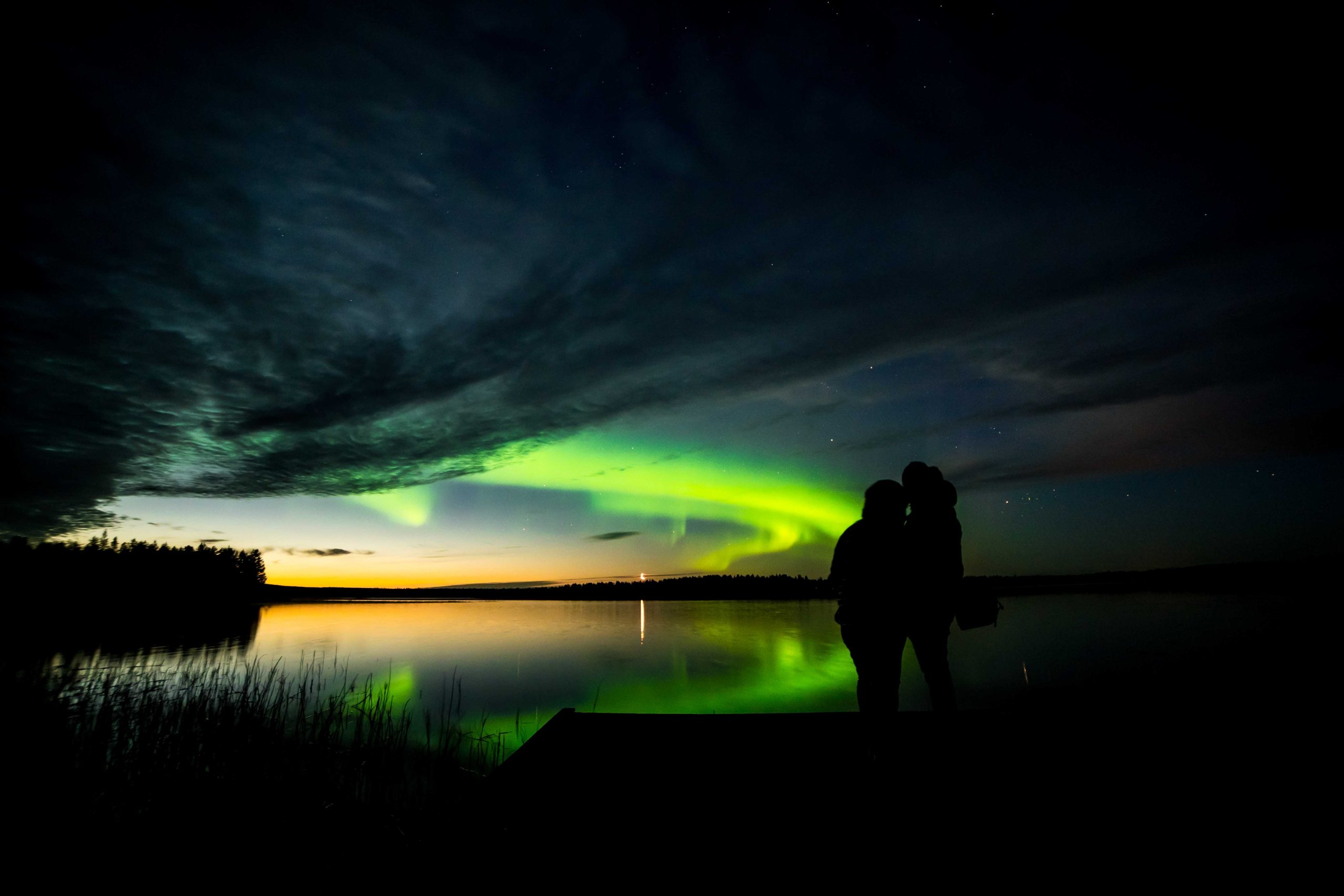 Northern Lights Couple Viewing River Reflection Autumn Lapland