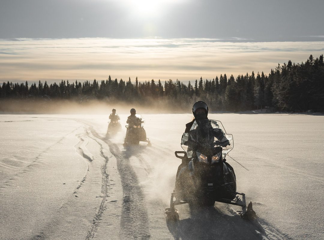 Electric snowmobiles on a winter trail near Rovaniemi