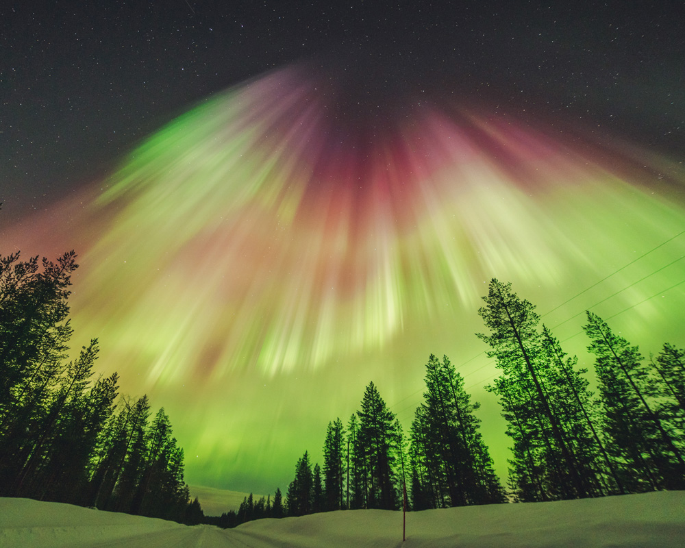Bright Aurora over the Lapland landscape
