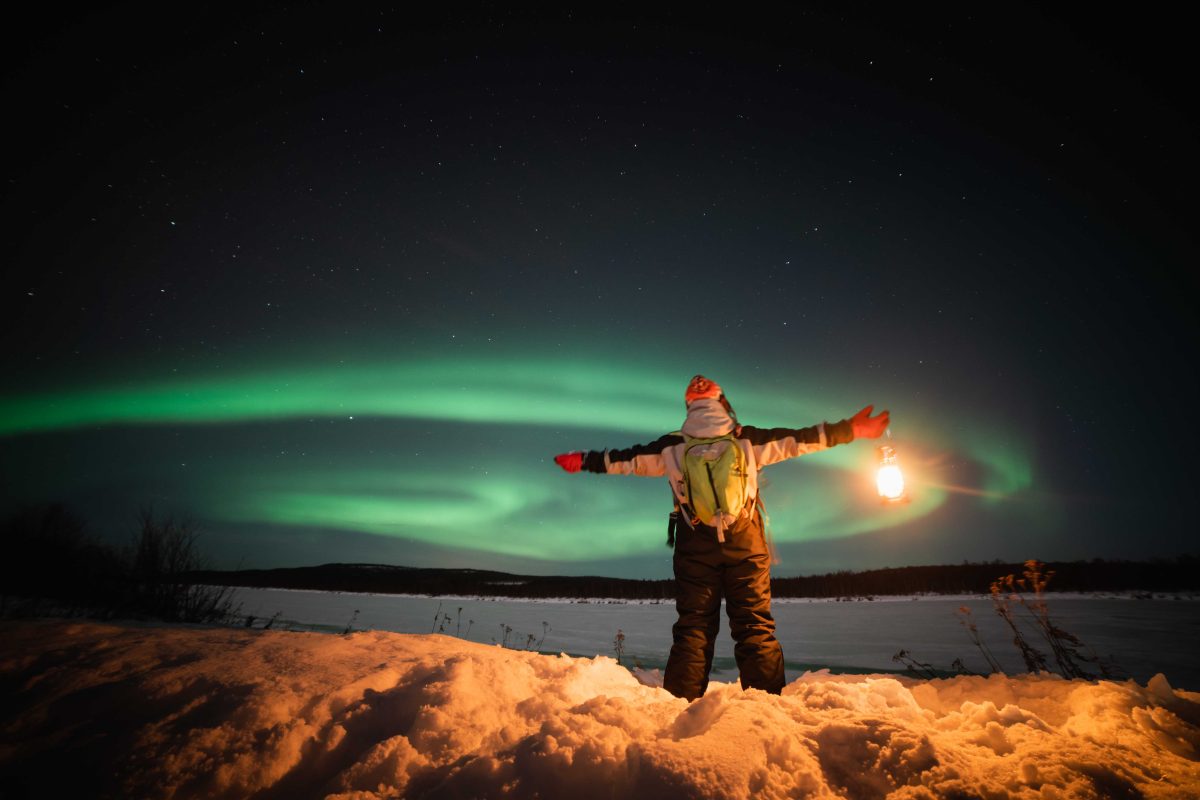 Northern Lights above a snowy frozen river