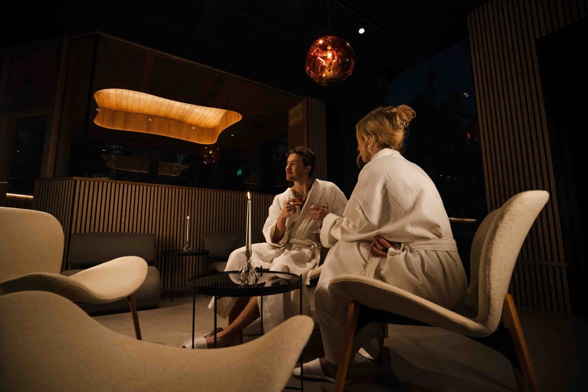Guests enjoying drinks in bathrobes at the restaurant