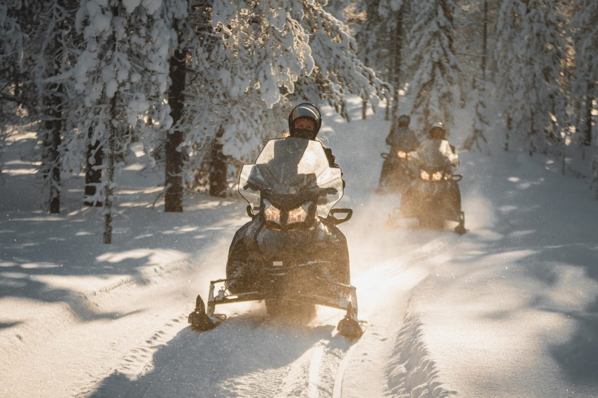 Electric snowmobile tour at sunrise in Rovaniemi