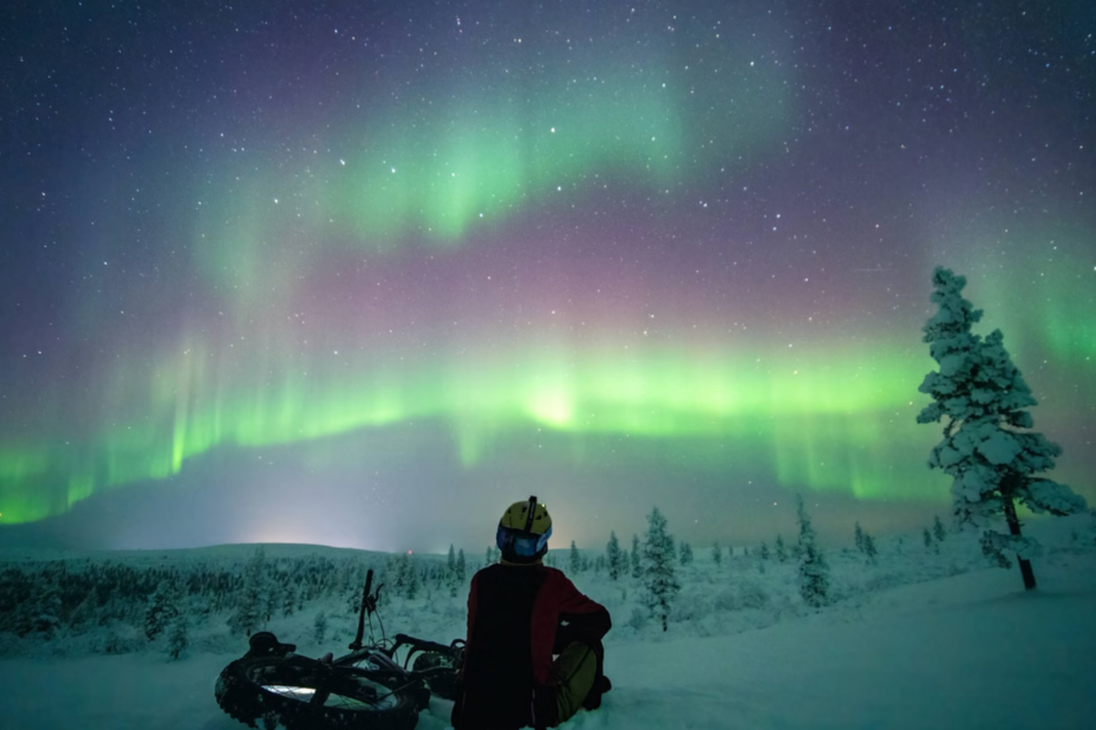 Northern Lights above an electric fatbike near Pyhä fell