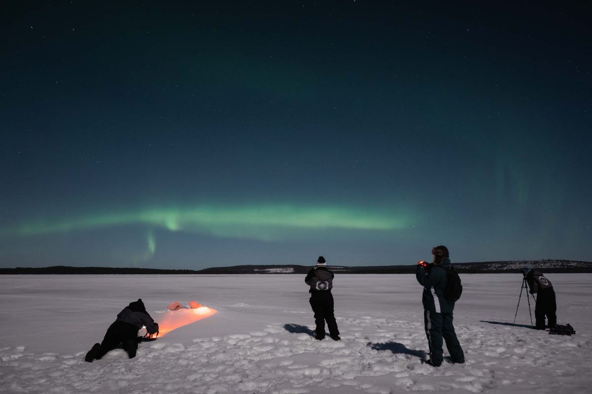 Group photographing the Northern Lights
