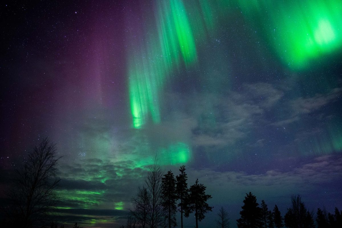 Northern Lights over a snowy Levi landscape