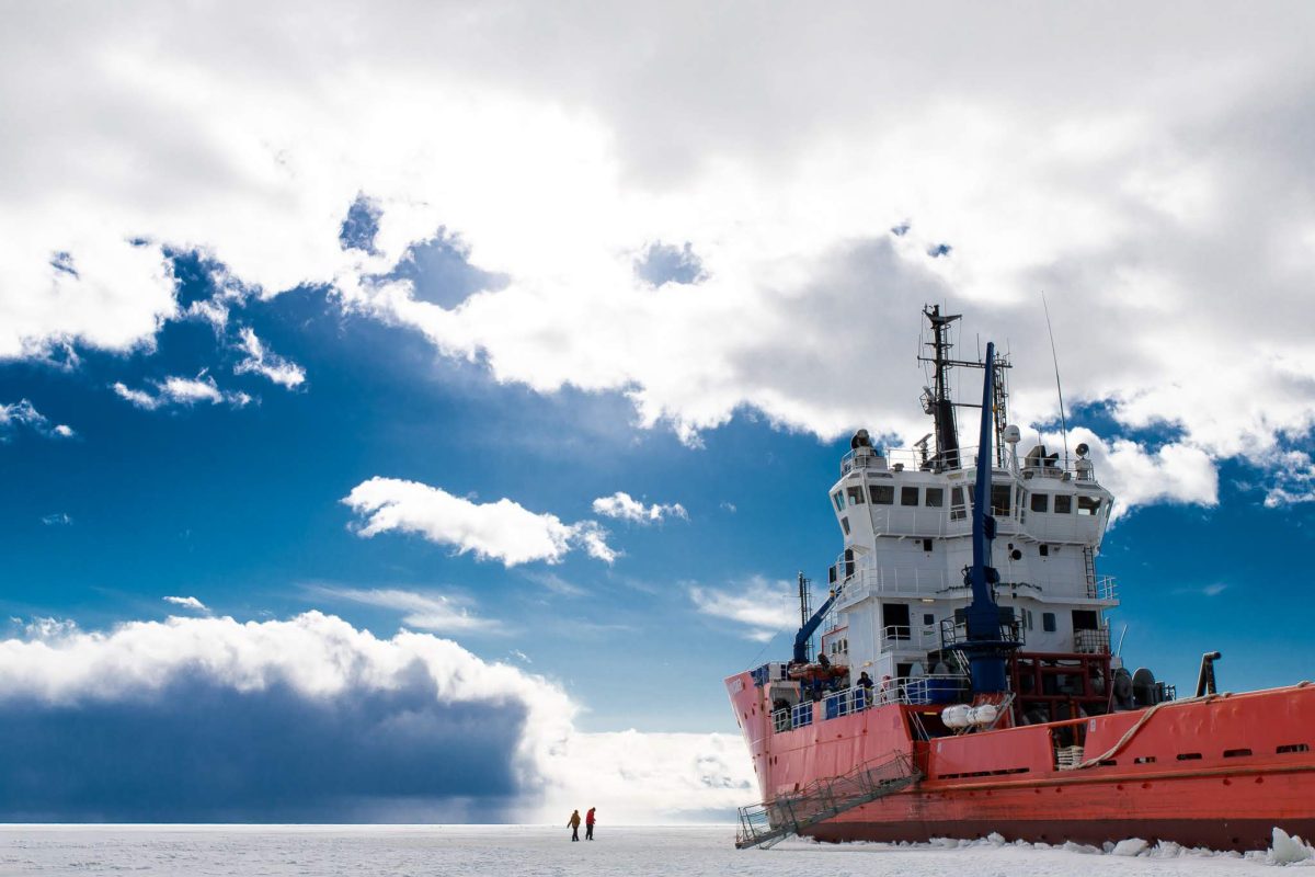 Polar Explorer Icebreaker under a blue winter sky