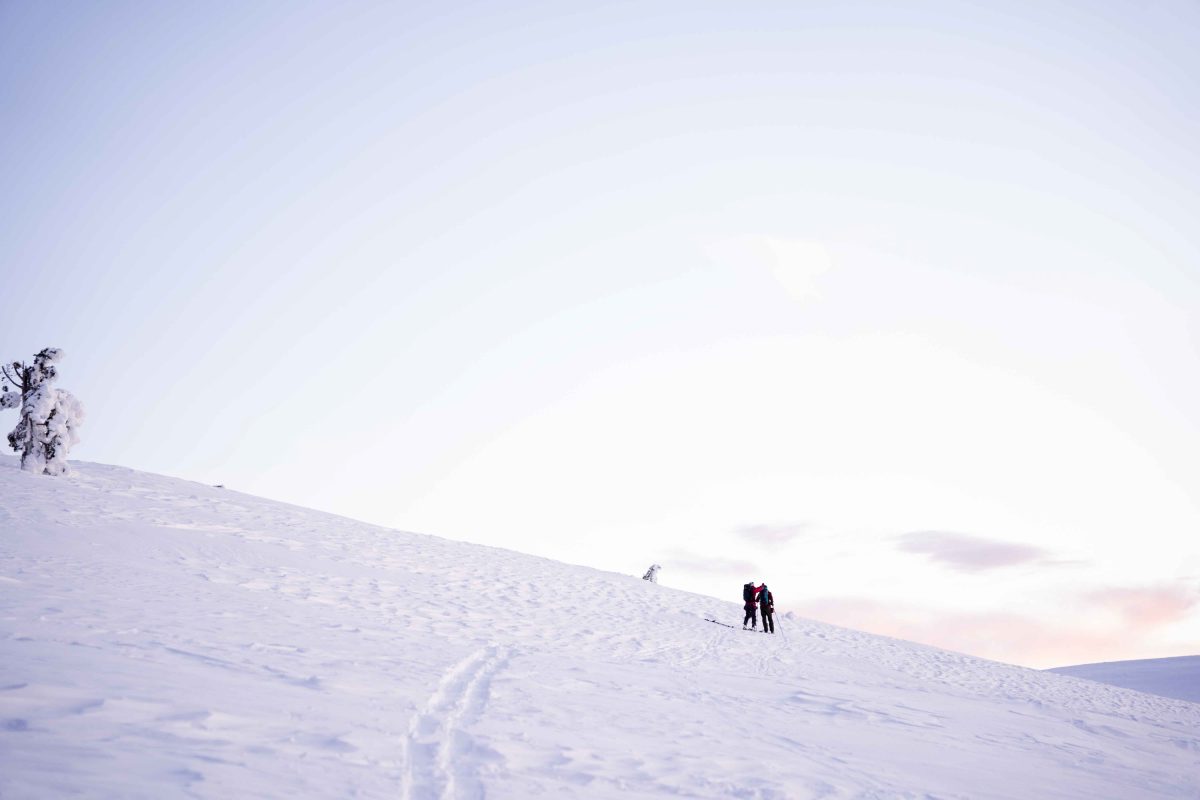 Snowshoeing across open fell terrain in Levi