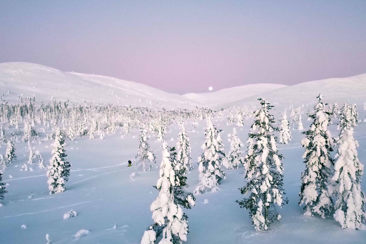 Moonrise above snowy fells near Levi